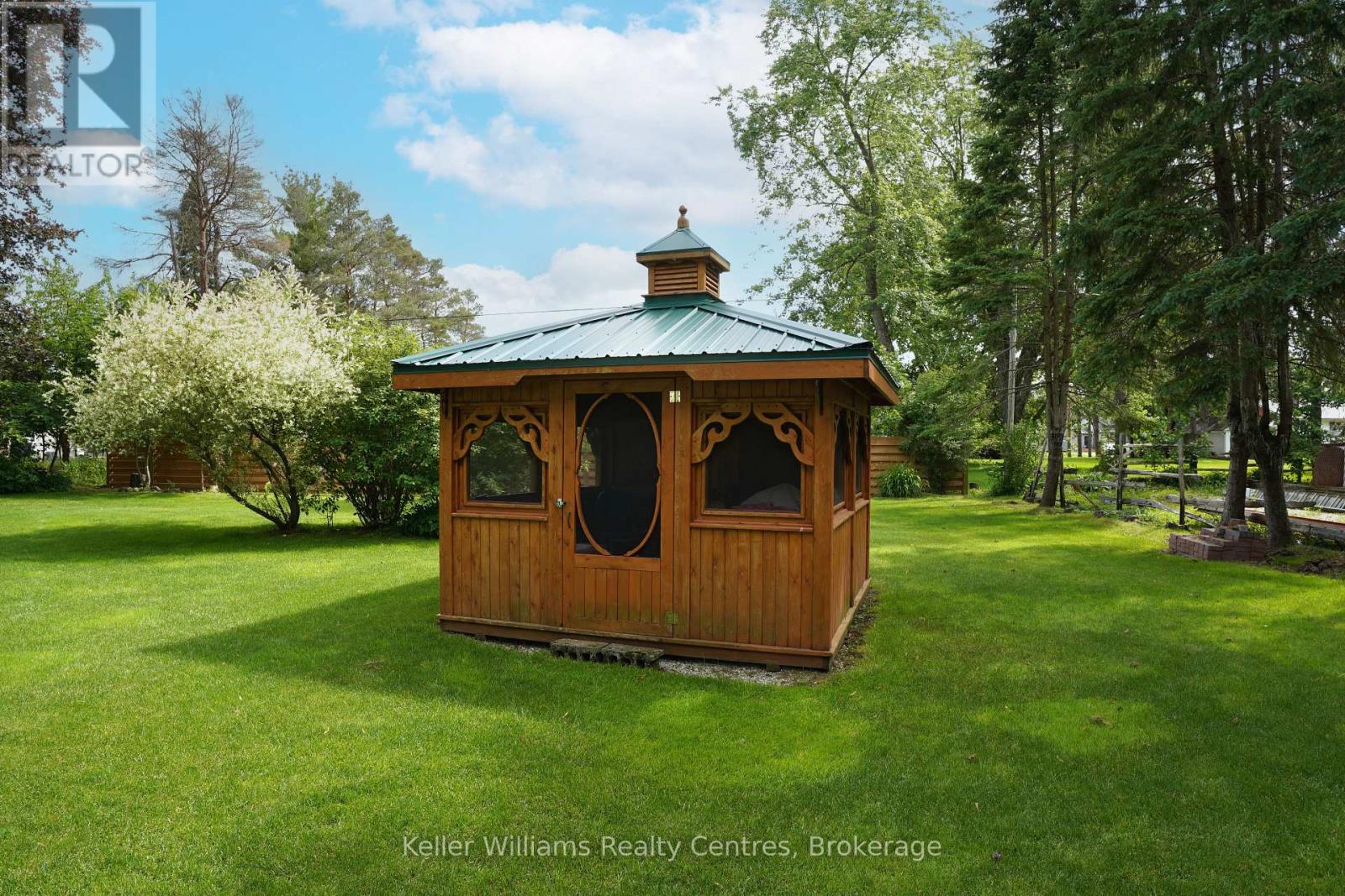 10×10 moveable cedar sunroom gazebo set on the back lawn